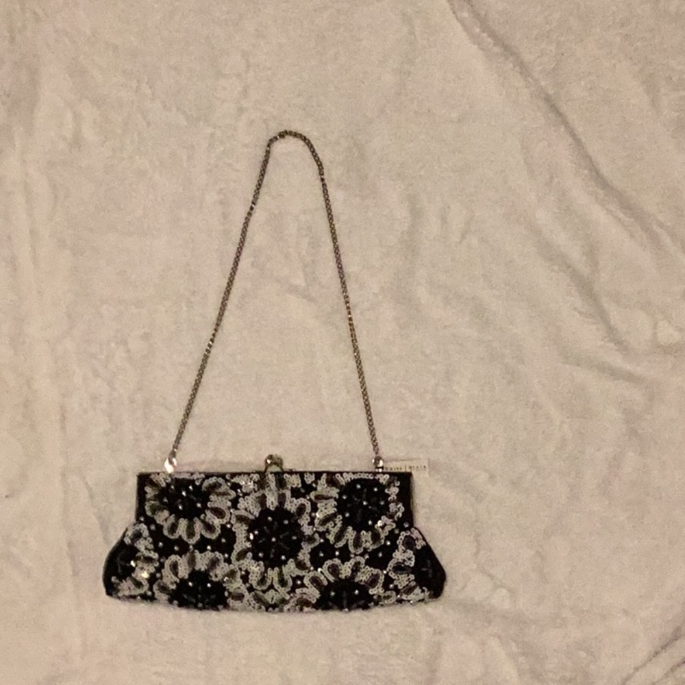 Sophisticated White House, Black market brand Black and Silver Floral Clutch